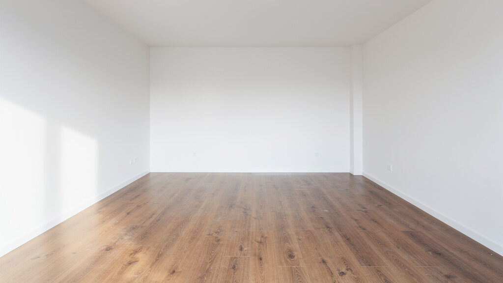 Junk removal crew loading apartment items into truck